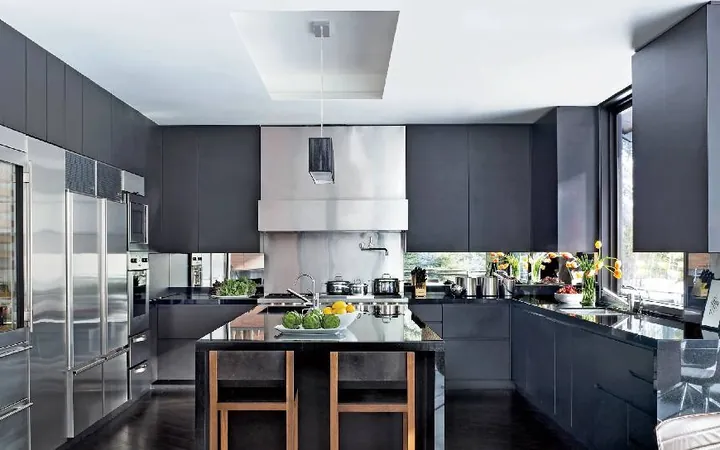A modern kitchen and living area with a dark floor